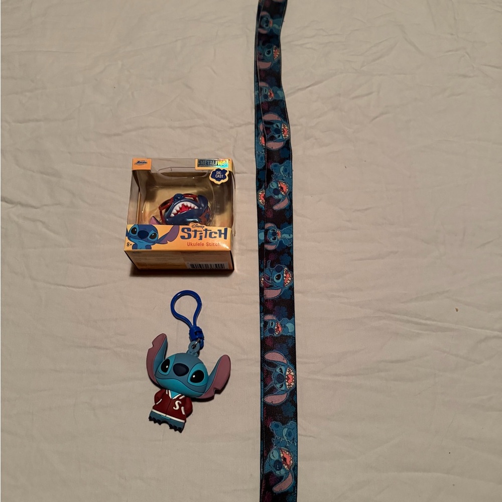 Disney Stitch figurines and lanyard